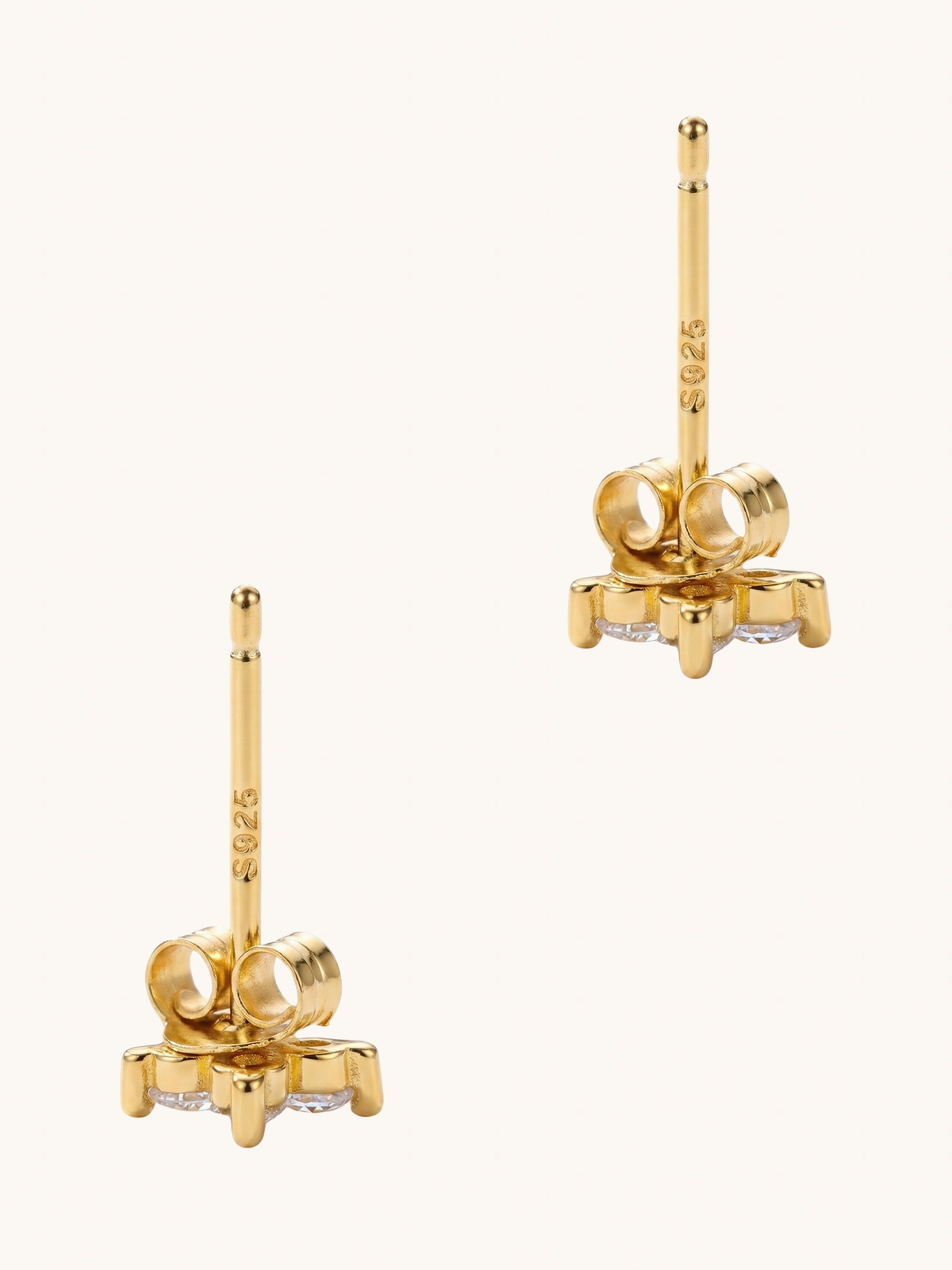 Gold Irene star stud earrings shown from the side with butterfly backs