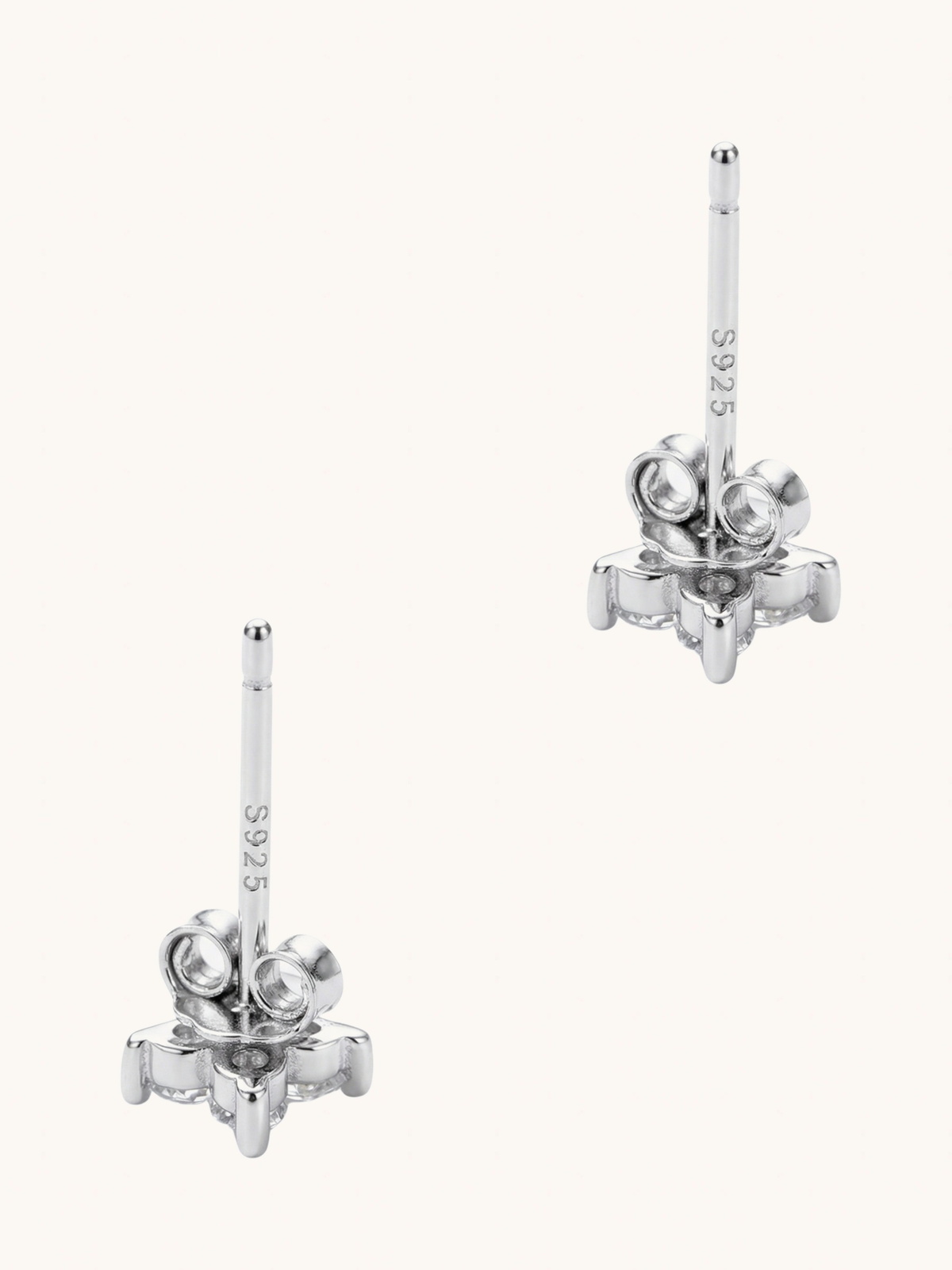 Irene star stud earrings shown from the side with sterling silver posts