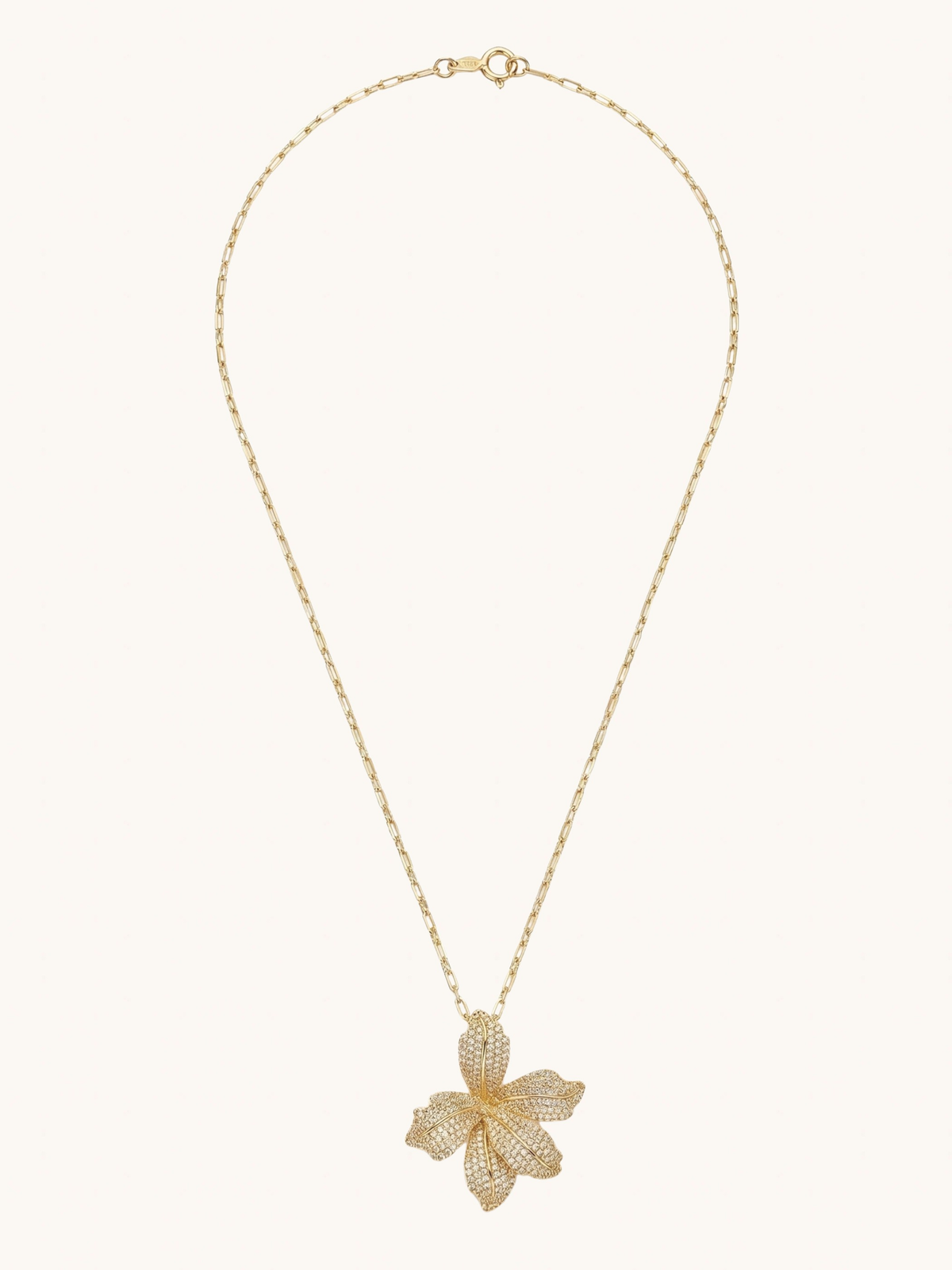 Full length view of the Orchid Bloom necklace in gold with a linked chain