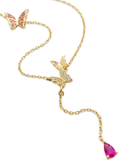 Close up of the Astrid necklace butterfly charms and pink pear cut cubic zirconia drop in gold plated sterling silver
