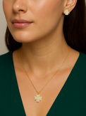 Model Wearing Cara Clover Pendant Necklace and Earrings in 18k Gold Plated Sterling Silver Fixed Length 925 Metal 16 inches 4.3gms