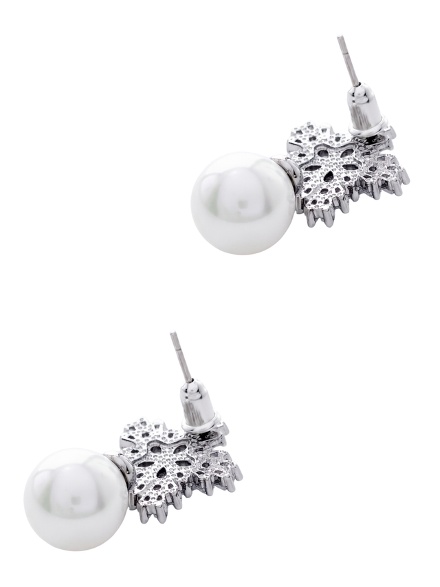 Angled view of the Blanca pearl earrings showing the shell pearl drop and sterling silver stud posts