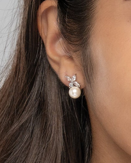 Close up of the Chloe pearl drop earring on the ear
