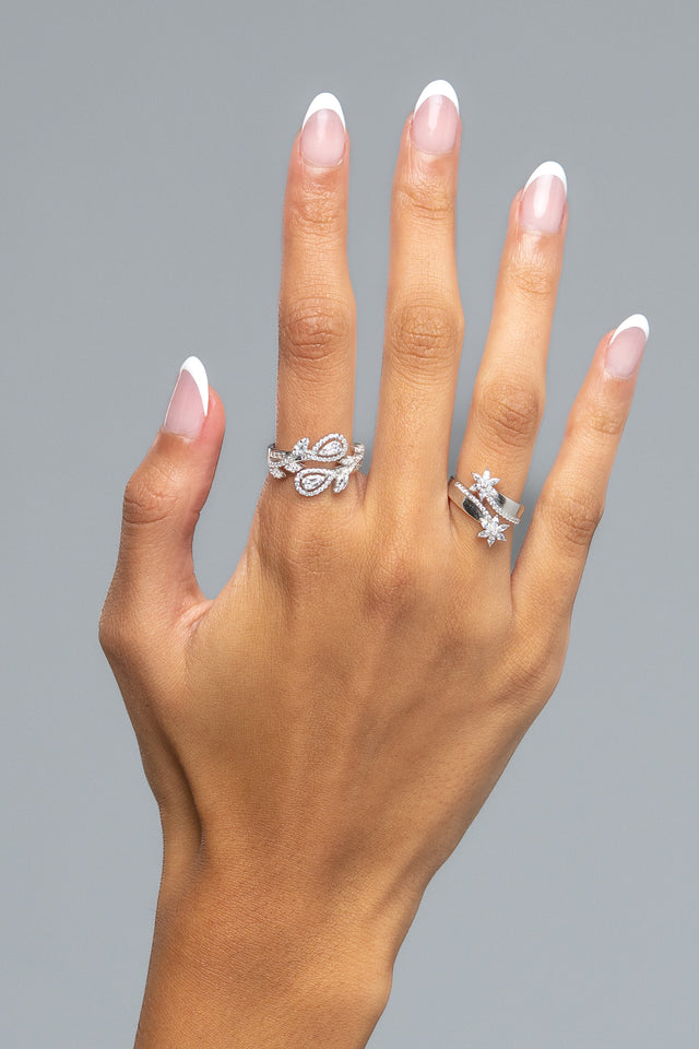 Cassy open ring worn on the hand, showing the adjustable leaf design