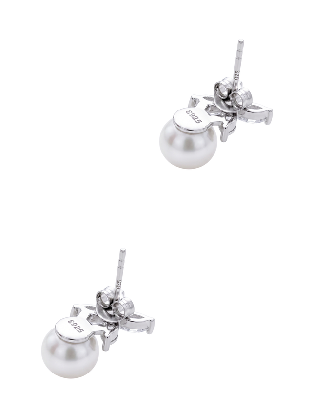 Angled view of the Chloe pearl drop earrings showing the sterling silver stud posts