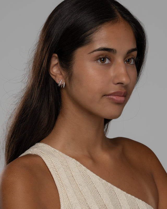 Carla claw earrings worn with a cream knit top for everyday wear