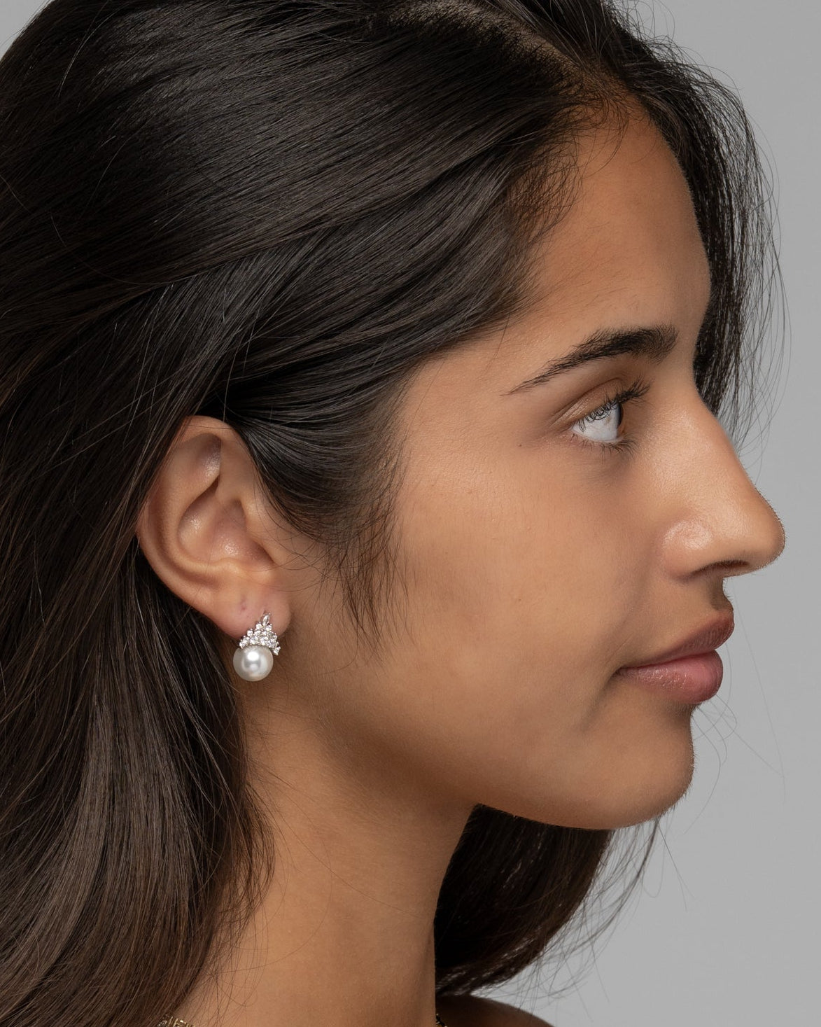 Side view of the Eleanor pearl drop earring worn on the ear