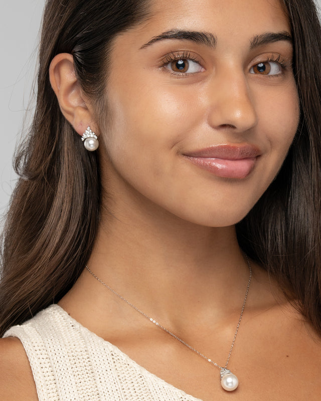 Model wearing the Eleanor pearl pendant necklace and earrings as a bridal jewelry set
