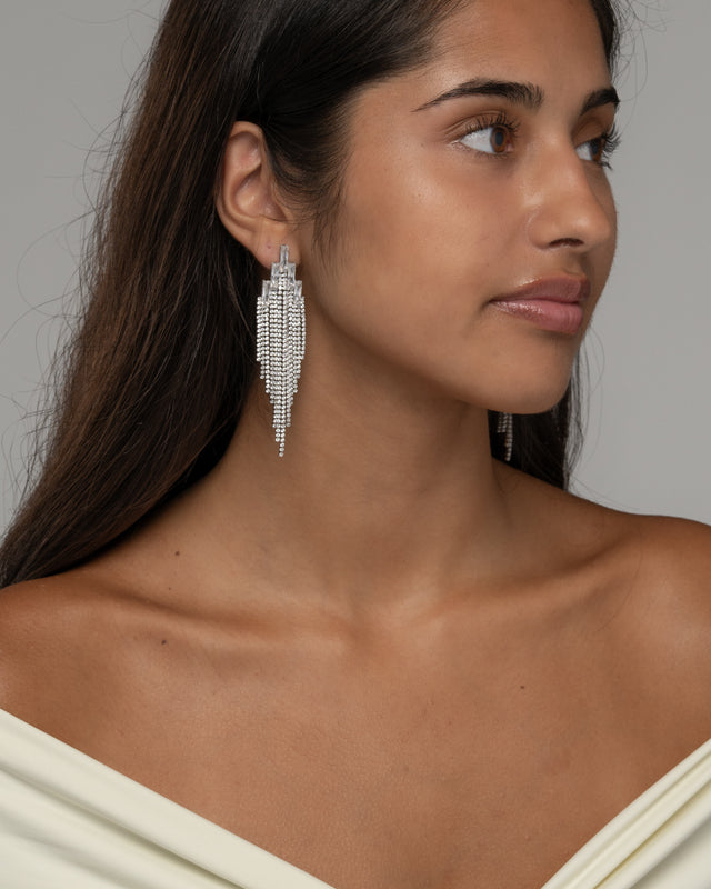 Side view of the Elise waterfall earrings, showing the fringe falling below the jaw