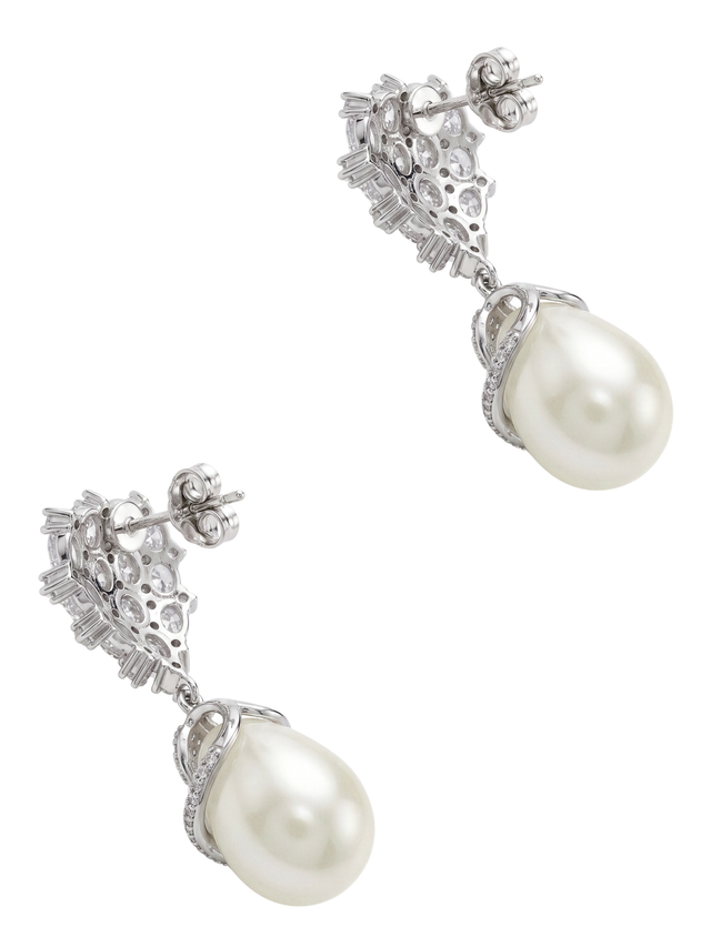 Angled view of the Ellara pearl dangle earrings showing the stud posts and pearl drops