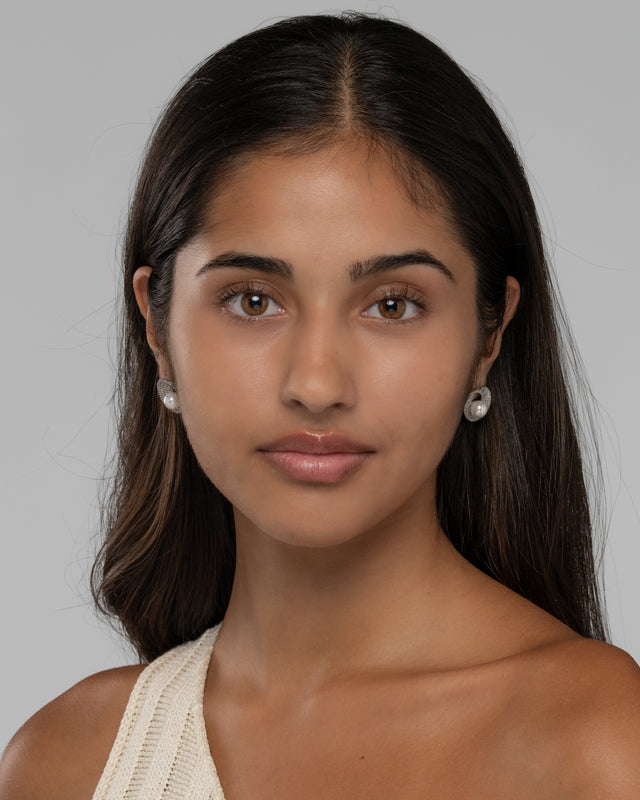 Lusterloop earrings worn with an off shoulder ivory top for a modern pearl look