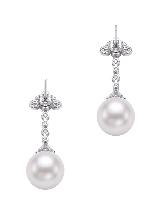 Angled view of the Perlina pearl dangle earrings showing the sterling silver posts