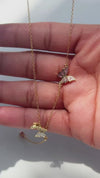 Video of the Astrid lariat necklace in 18k gold plated sterling silver with butterfly charms and a pink pear cut drop
