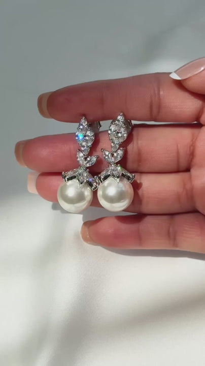 Video of the Rania pearl dangle earrings with marquise cubic zirconia leaves and a pearl drop