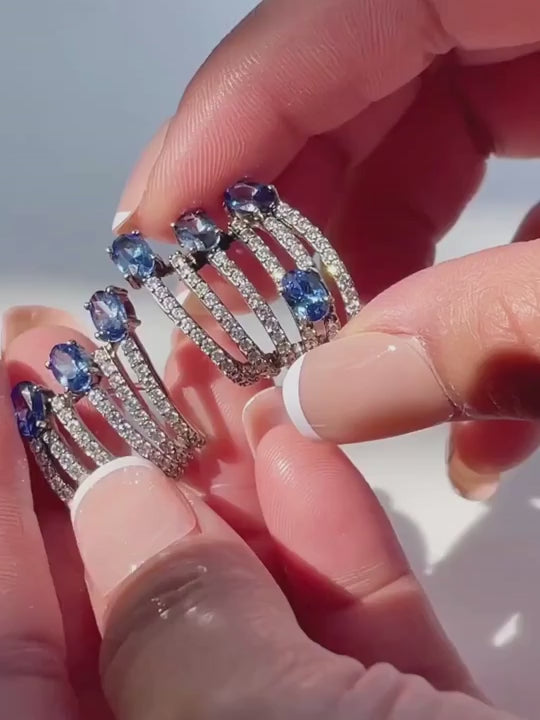 Video of the Nia claw earrings in 925 sterling silver with blue stones and pave bars