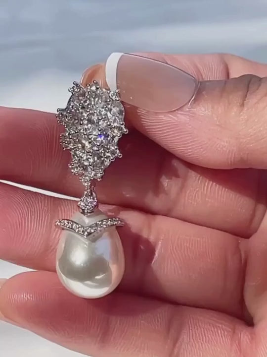 Video of the Ellara pearl dangle earrings with cubic zirconia clusters and teardrop pearl drops