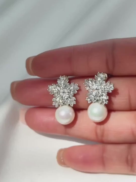 Video of the Blanca pearl earrings, cubic zirconia flower studs with a shell pearl drop