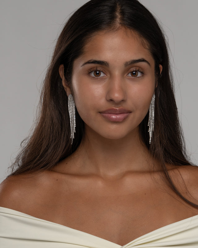 Sally shimmer earrings styled with an off shoulder cream top for a wedding guest or party look